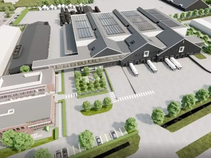 Ontwerpimpressie van een bedrijfsterrein met groene parkeerplaats en laaddocks