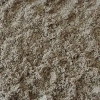Fijn zand in beige- en grijstinten, ruw opgehoopt